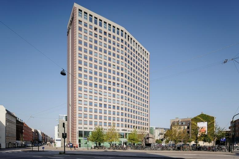 Exterior view of the multi-story brick and glass building at Gl. Kongevej 60, Denmark, Frederiksberg.