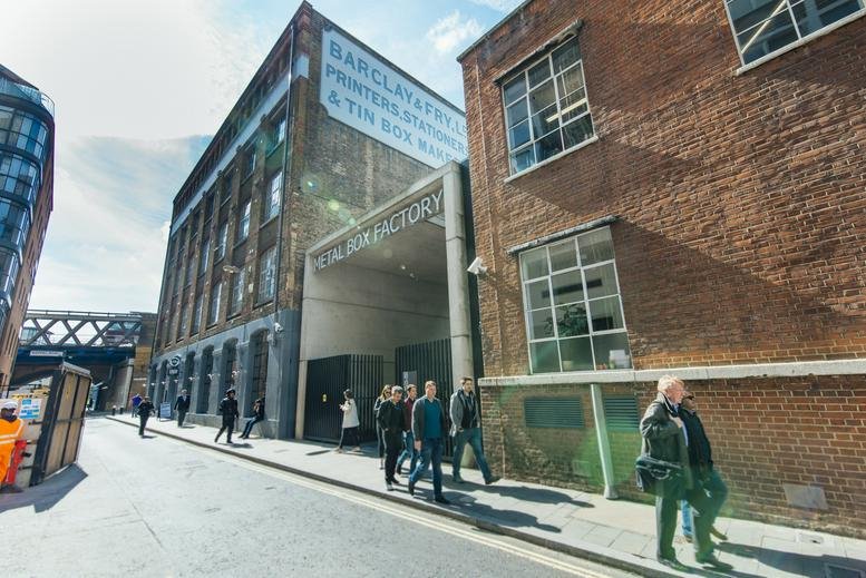 Exterior of Great Guildford Business Square with its brick facade and arched entrance.