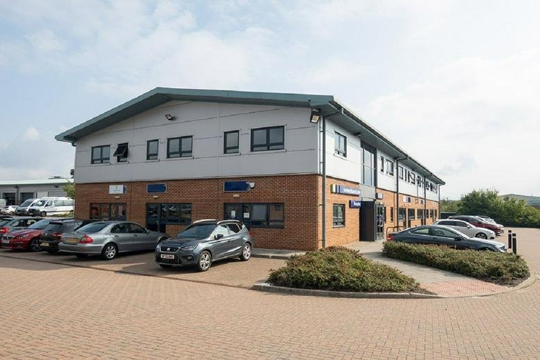 Exterior view of the brick and grey facade at Greenway Business Centre, Harlow Business Park.