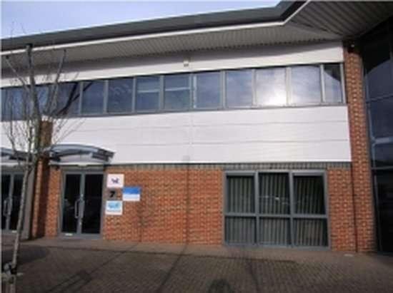 Exterior view of the brick and glass facade at Rotherbrook Court (Ground Floor, Unit 7).