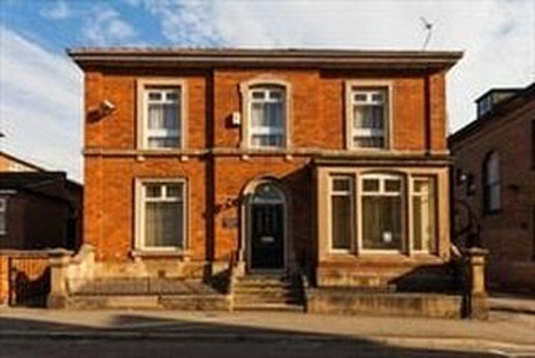 Exterior view of the red brick facade at Halliday House, 2 Wilson Street, Derby, Derbyshire.
