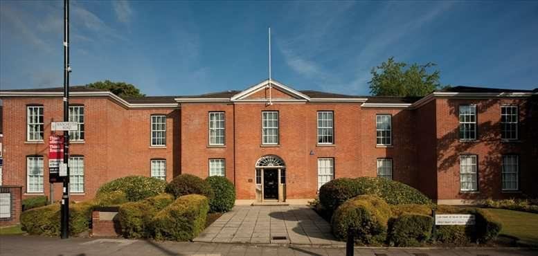 Exterior view of the historic red brick facade at Haw Bank House, High Street, Cheadle.