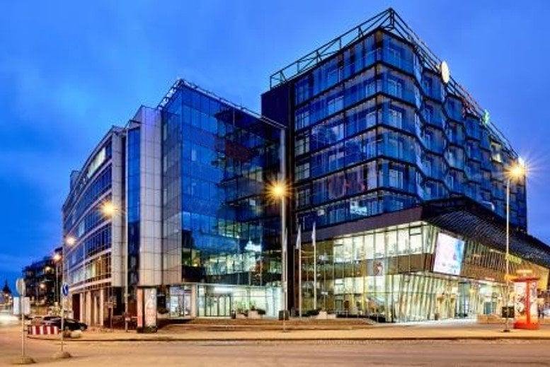 Evening exterior of the modern glass facade at Hobujaama 4, Tallinn, Estonia.