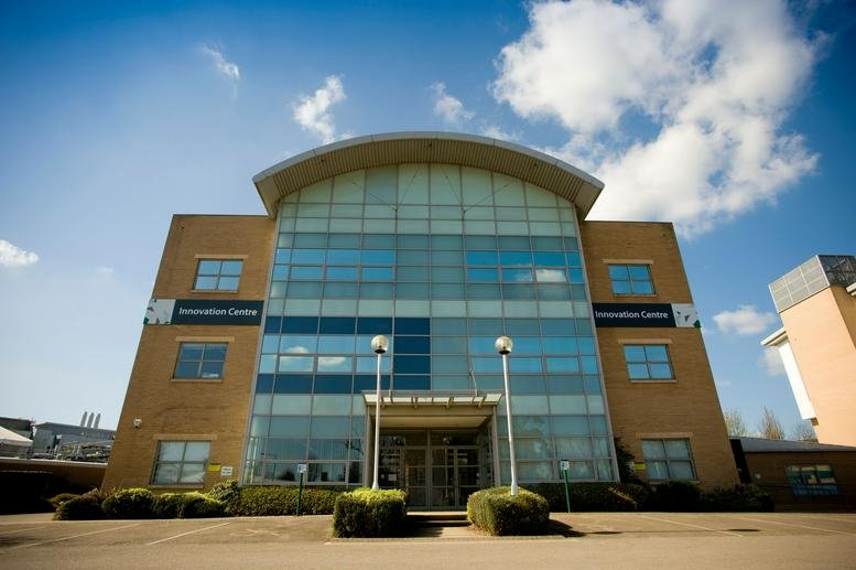 Exterior view of the arched roof and glass facade of the Innovation Centre.