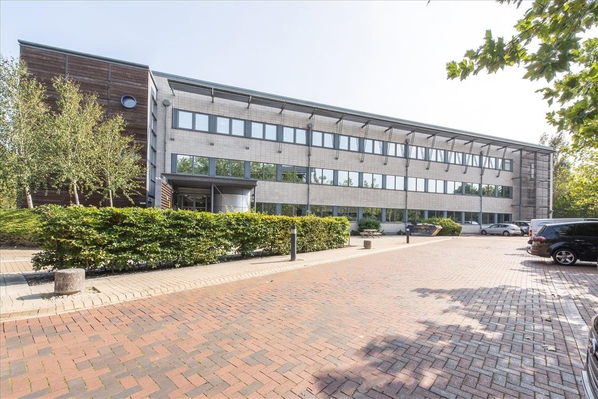 Exterior view of the contemporary facade and brick forecourt at John Eccles House.
