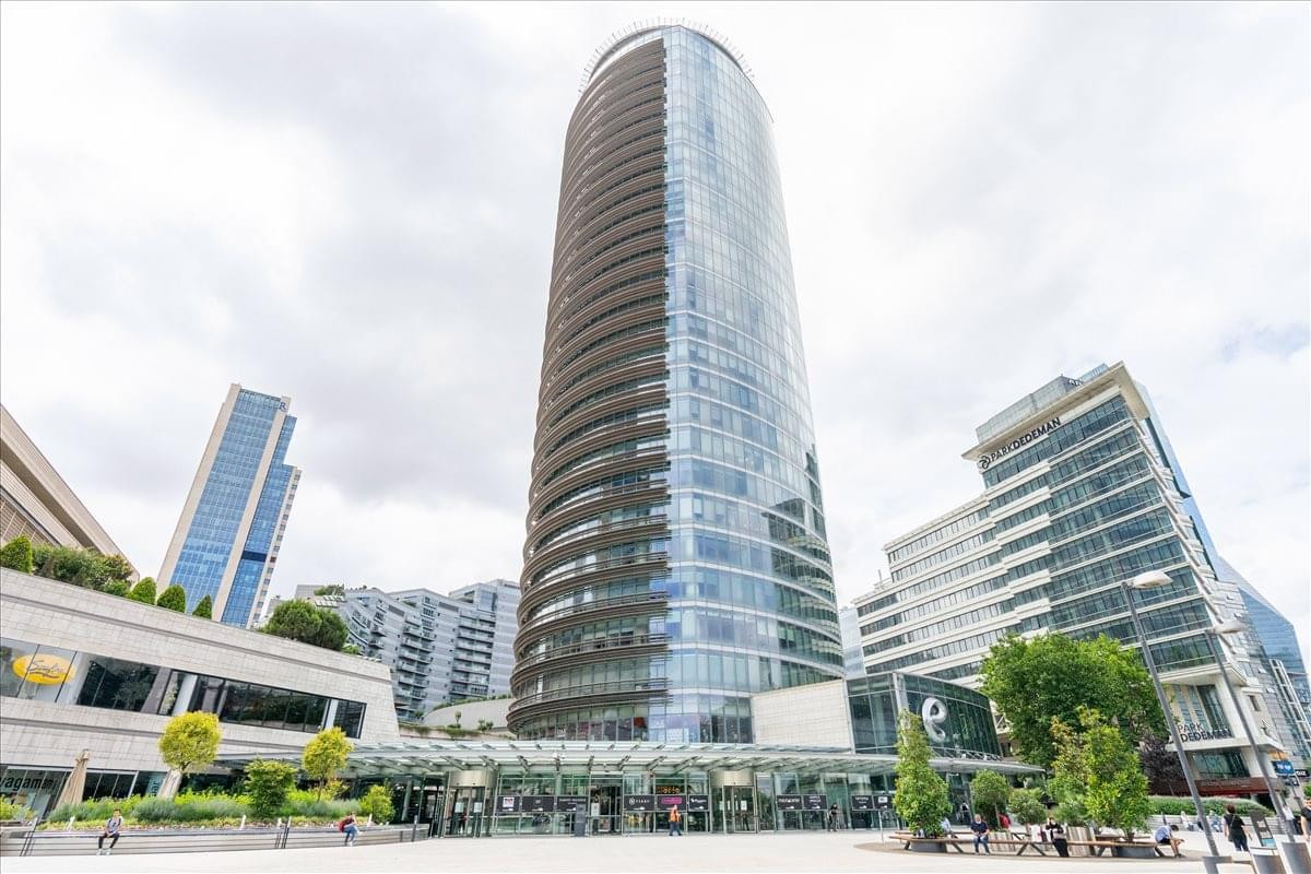 Exterior view of the curved glass facade of Kanyon, Buyukdere Cad. No. 185.
