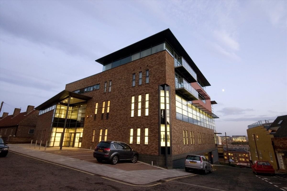 Exterior view of the brick facade and glass entrance at Keel House, Garth Heads.