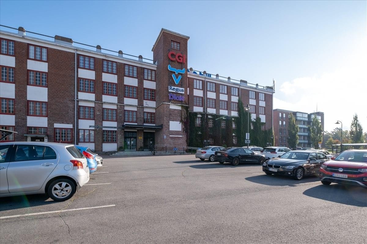 Exterior view of the brick Kehämylly building and parking lot.