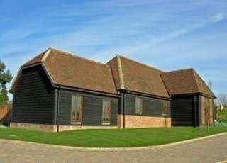 Exterior view of the traditional black timber-clad Kingsclere Barns, Kingsclere, Newbury, Berkshire.