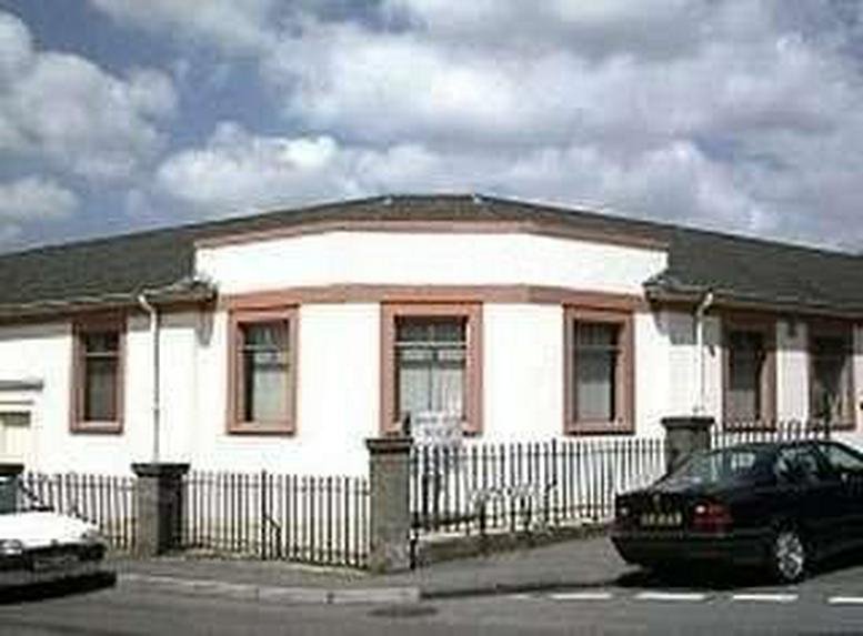 Exterior view of the white facade and dark roof of Kingswood House, South Road.