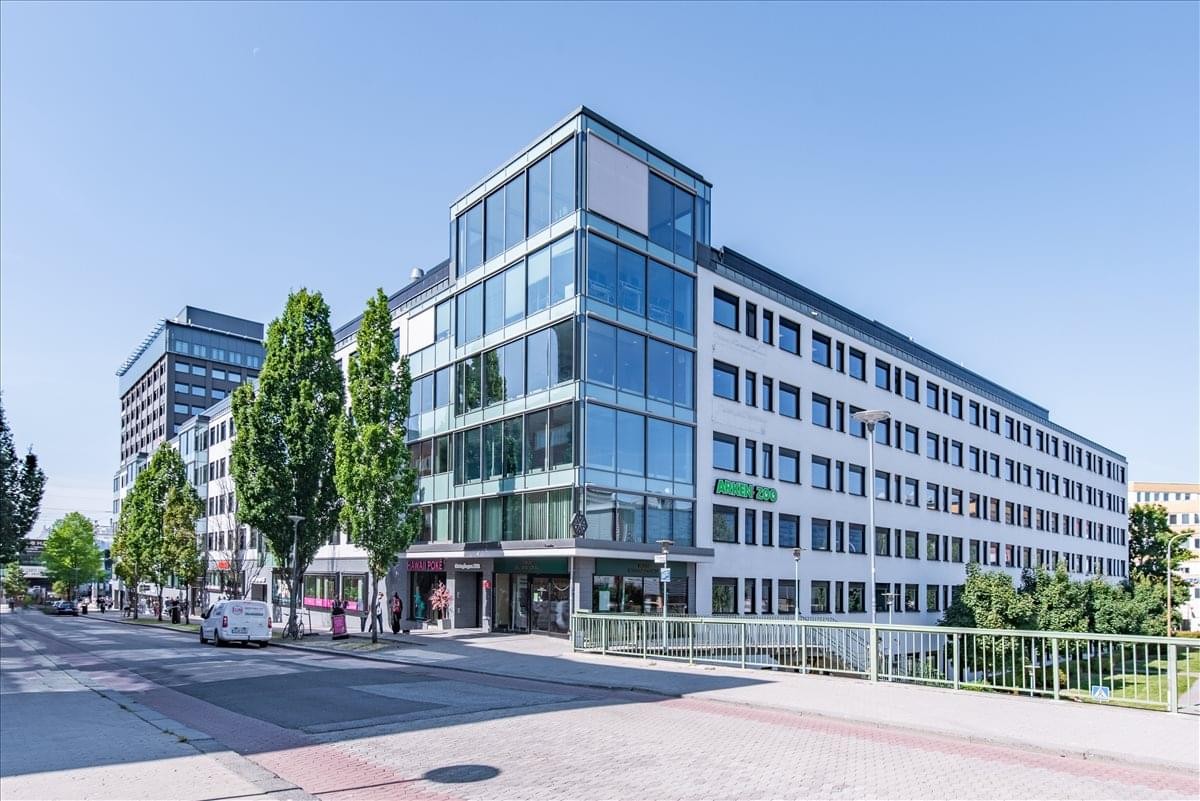 Exterior view of the contemporary KistaOne building with glass and white facades.