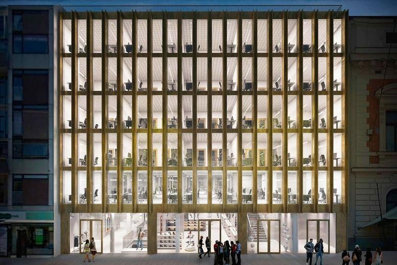 Exterior view of the modern glass and gold-toned facade of Kungsportsavenyn 21, Gothenburg.