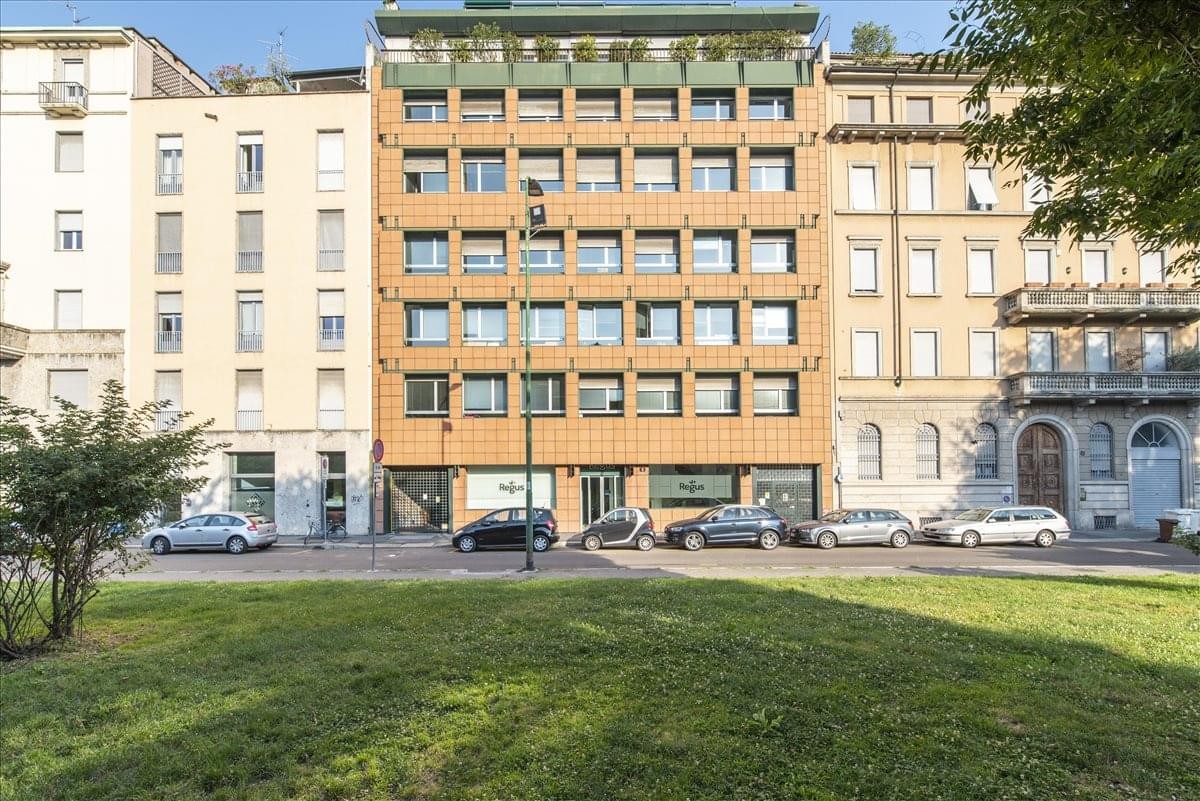 Exterior view of the historic brick and stone facade at Largo Richini 6.