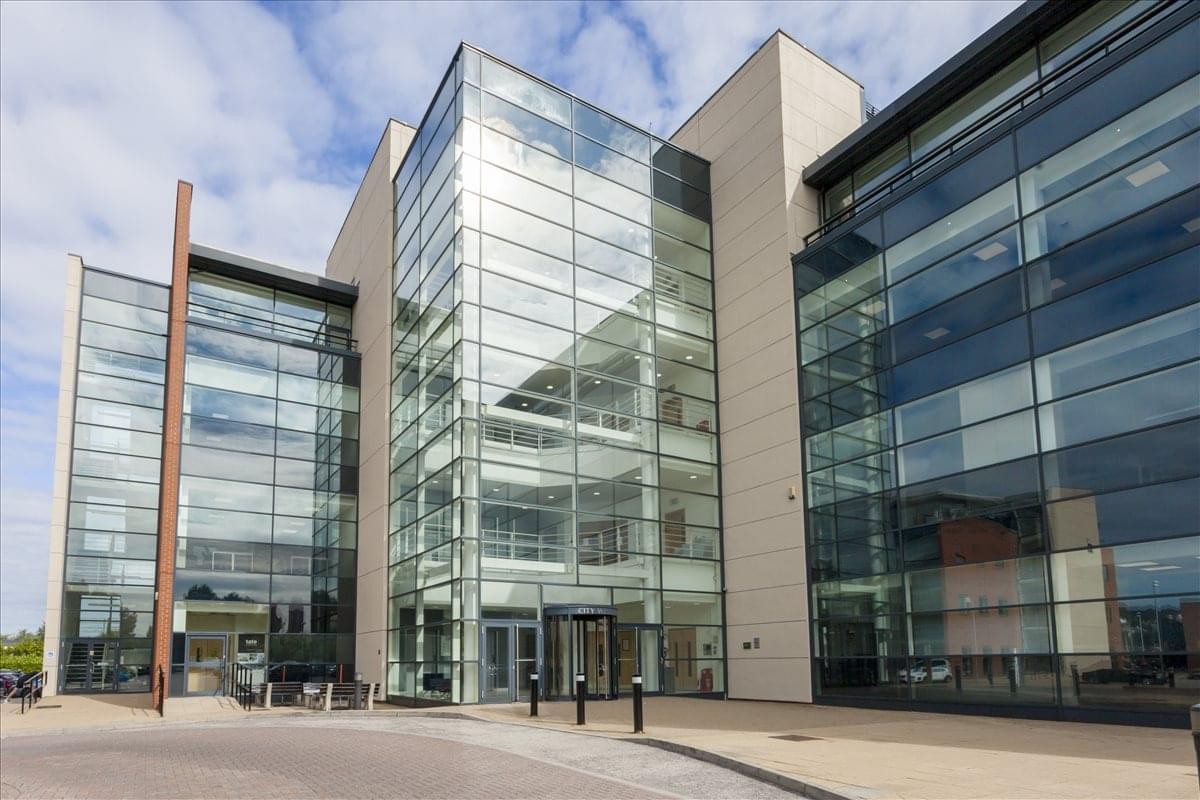 Exterior view of the contemporary glass and stone facade at Leeds City West Business Park.