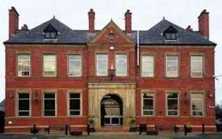 Symmetrical red brick exterior of the building at Lower Warrengate, Wakefield, Yorkshire, United Kingdom.