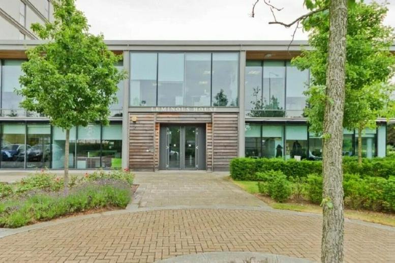 Exterior view of the glass and wood-cladded facade of Luminous House, 300 South Row.