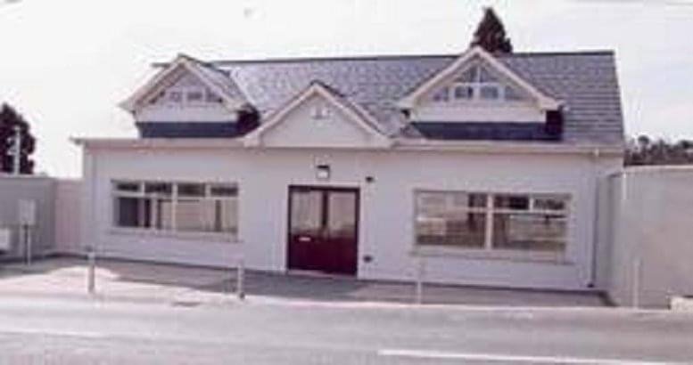Exterior view of the white facade and gabled roof of the office at Main Highstreet, Delgany Village.