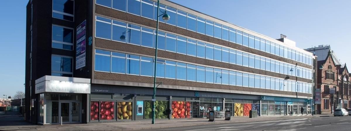 The brick and glass facade of Mansion House, Wellington Road South, Stockport, Cheshire.
