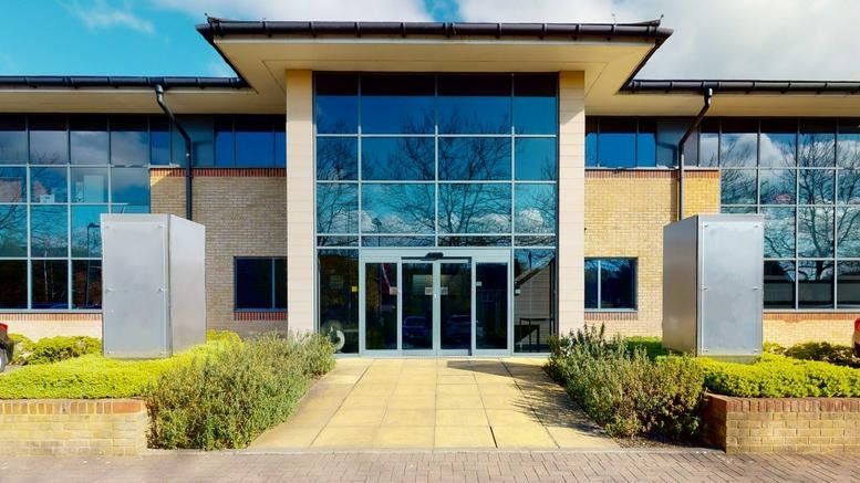 Exterior entrance of the modern glass-fronted Merlin House, No 1 Langstone Business Park.