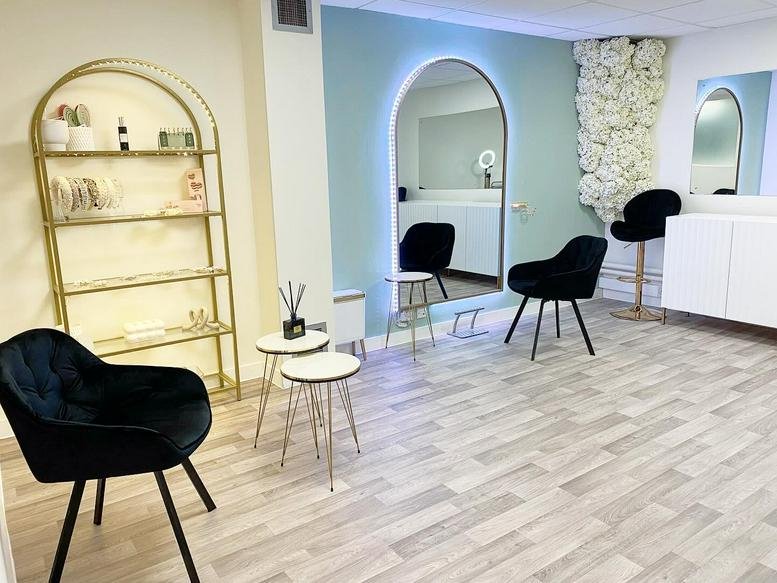 Bright reception area at Innovation House, Molly Millars Close with velvet chairs and a floral feature wall.