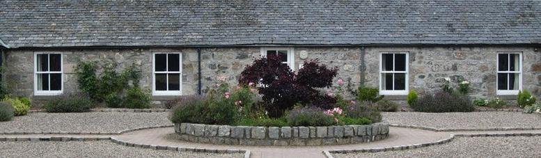 Exterior view of the stone facade and landscaped courtyard at Netherton Rural Business Centres.