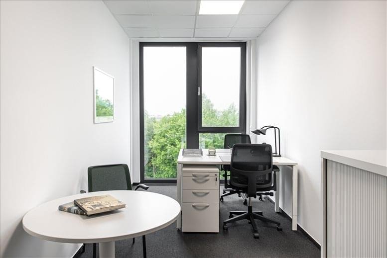 Private office suite with natural light and views of greenery.