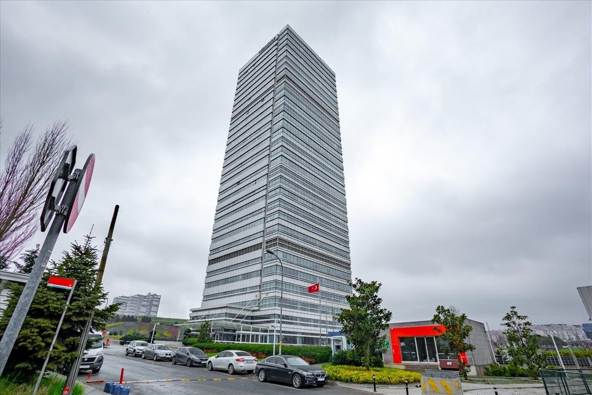 Exterior view of the soaring glass-facade Nidakule Göztepe skyscraper.