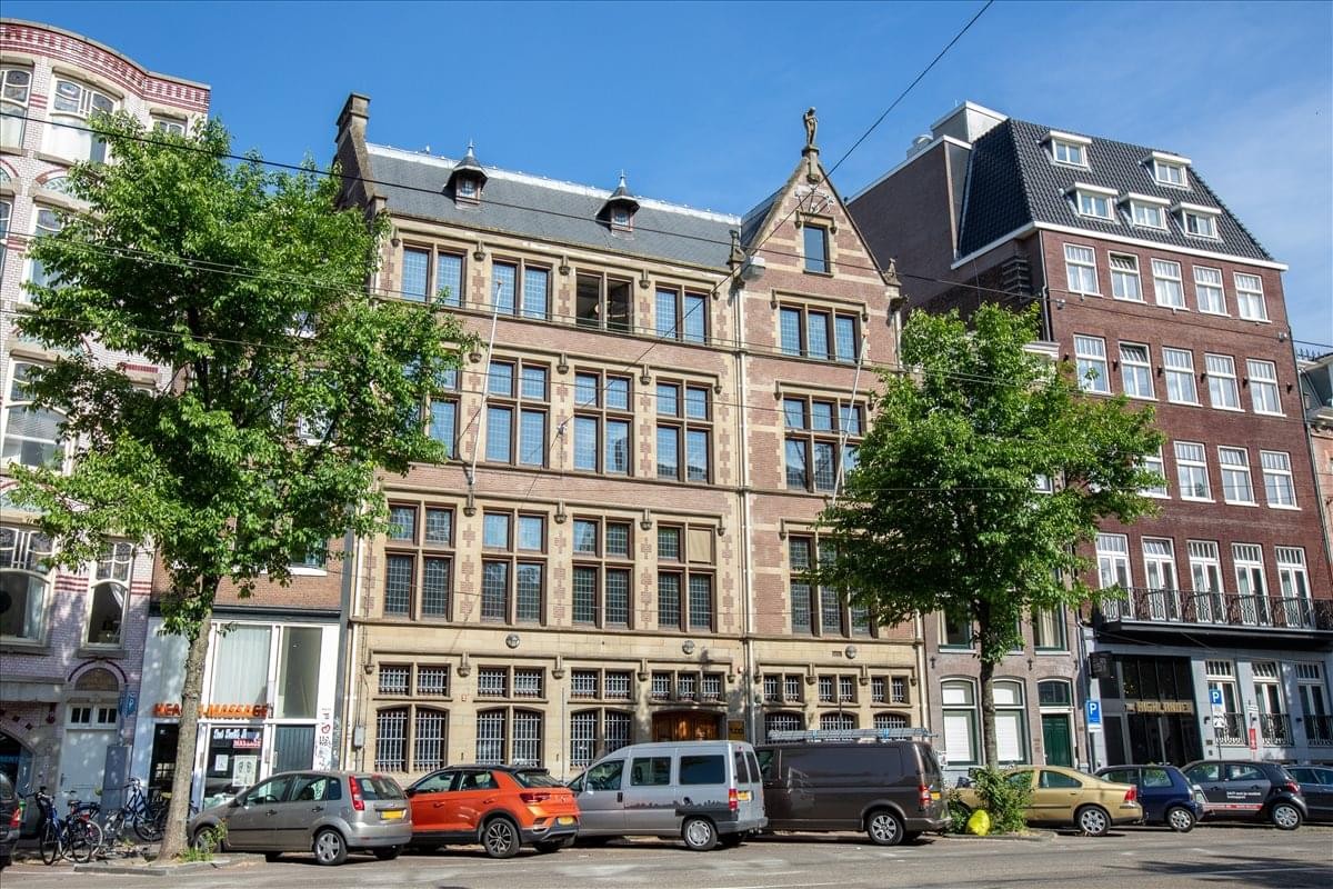 Exterior view of the historic brick facade at Nieuwezijds Voorburgwal 104, 108.