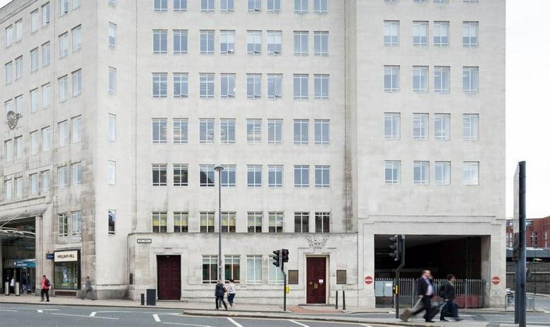 The grand stone exterior of No. 1 Aire Street, City Centre, Leeds, featuring numerous windows and street-level entrances.