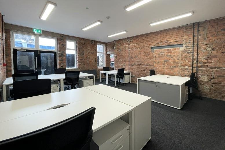 Exterior view of the historic red brick building at No. 1 Clock Tower Park.