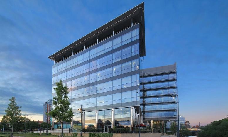 Exterior view of the modern glass-facade No. 1 Whitehall Riverside building.