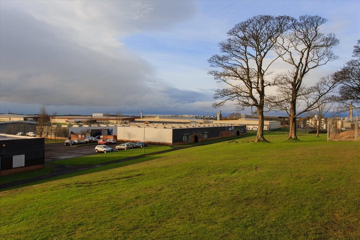 Exterior view of the North West Industrial Estate, Peterlee, Durham, Durham County buildings with grassy hill.
