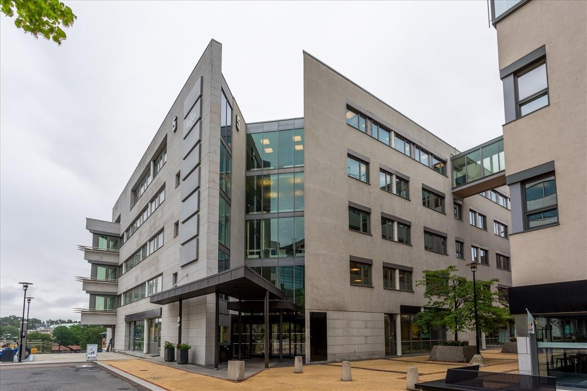 Exterior view of the modern stone and glass facade of Lysaker Torg 5, 3rd Floor, Lysaker, Norway.