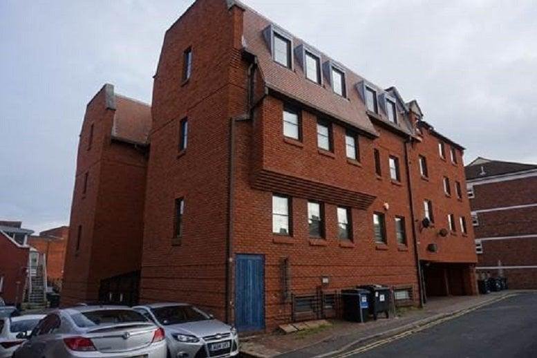 Exterior view of the red brick facade of Oliver House, Hall Street, Chelmsford, Essex.