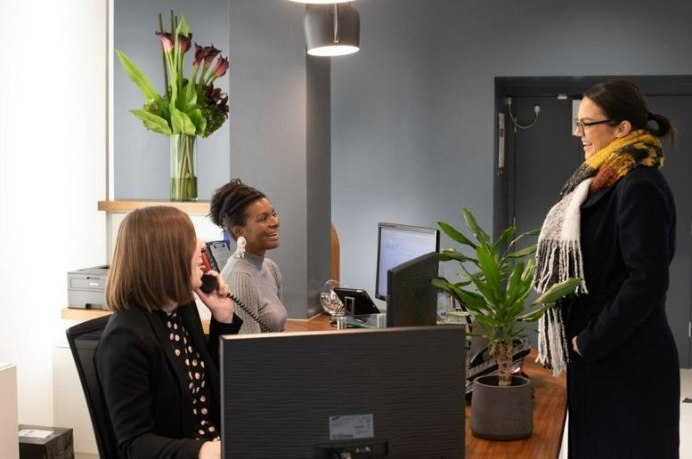 Professional reception area at Serviced Offices on The Strand, London, with a staffed front desk.