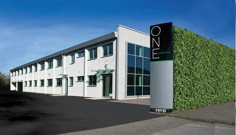 Exterior view of the white facade and landscaped entrance at One St Peter’s Road, Maidenhead, Berkshire.