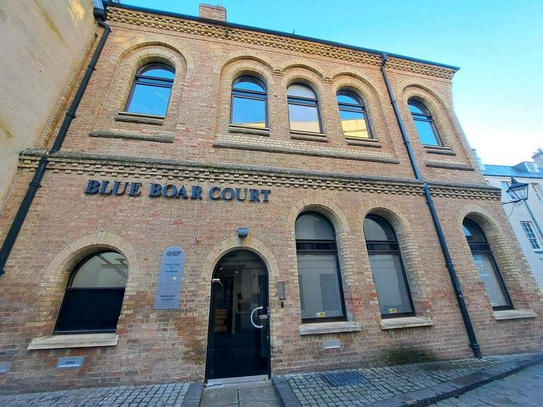 Exterior view of the historic brick facade at the Oxford Centre for Innovation, New Road.