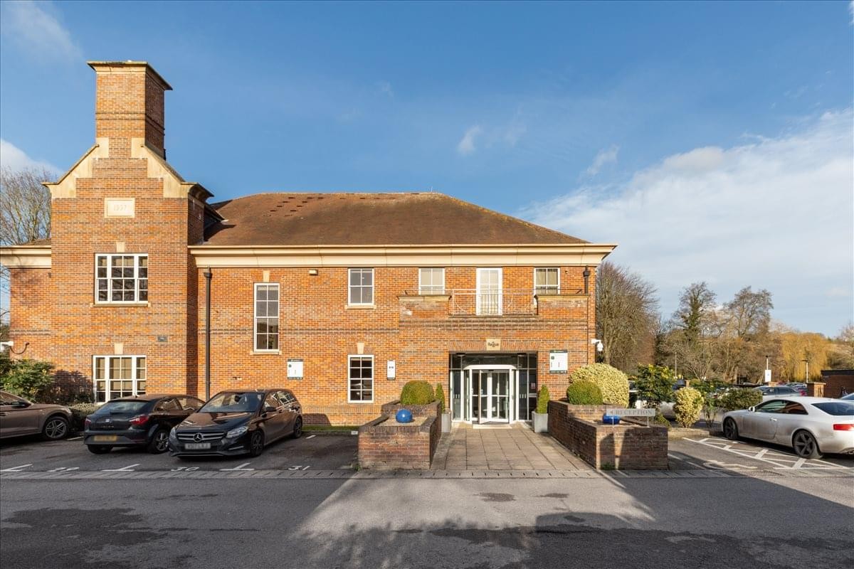Exterior brick facade and entrance of Palladia St Mary’s Court with parking area.