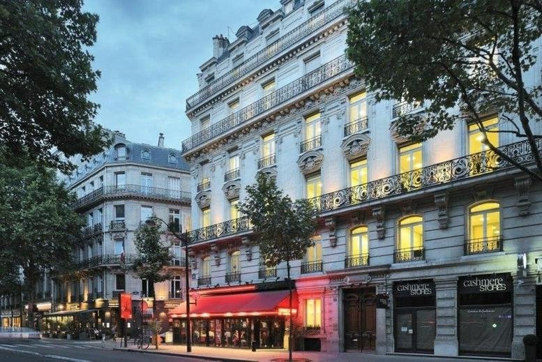 Exterior facade of Paris Rond-Point Des Champs Elysées, 6 avenue Franklin D. Roosevelt showing classic architecture.