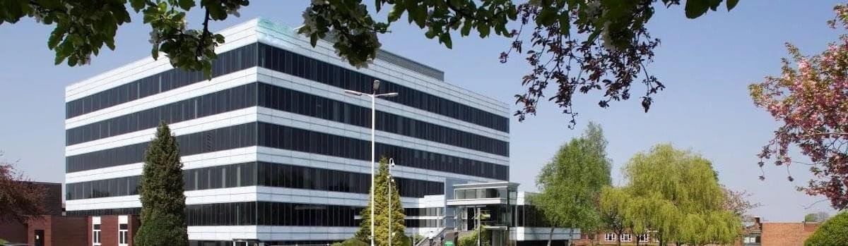 Exterior view of the striped facade at Park Square, 3rd Floor, Bird Hall Lane, Cheadle, Stockport.