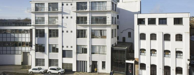 Exterior view of the white multi-story facade of Parma House in Wood Green.