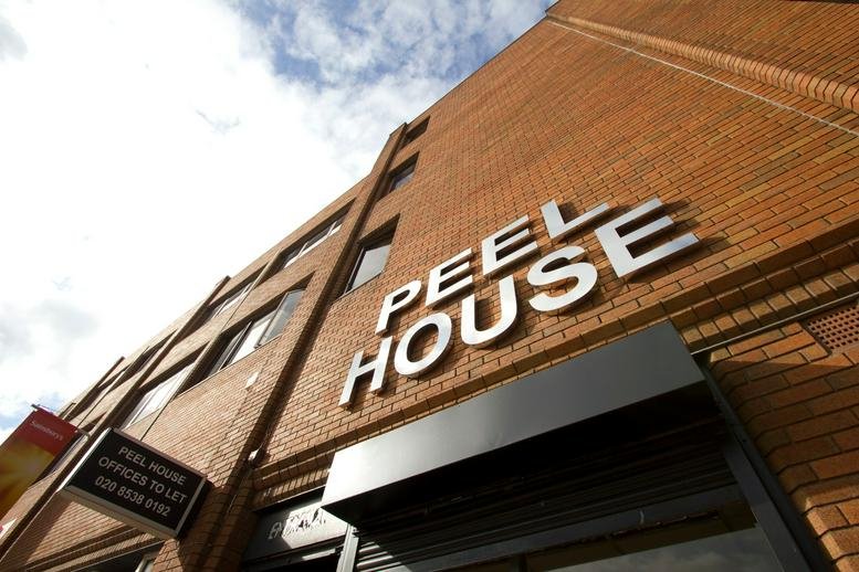 Low-angle exterior view of the brick facade at Peel House.
