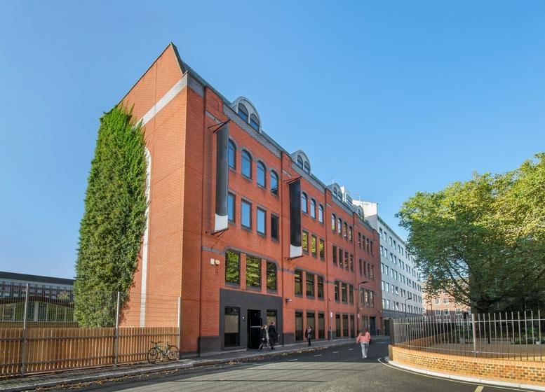 Exterior view of the red brick facade at Peer House, 8-14 Verulam Street, London.
