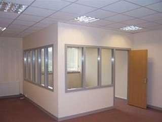 Interior of Pentland House, Saltire Centre, Glenrothes, Scotland featuring a partitioned office with glass windows.