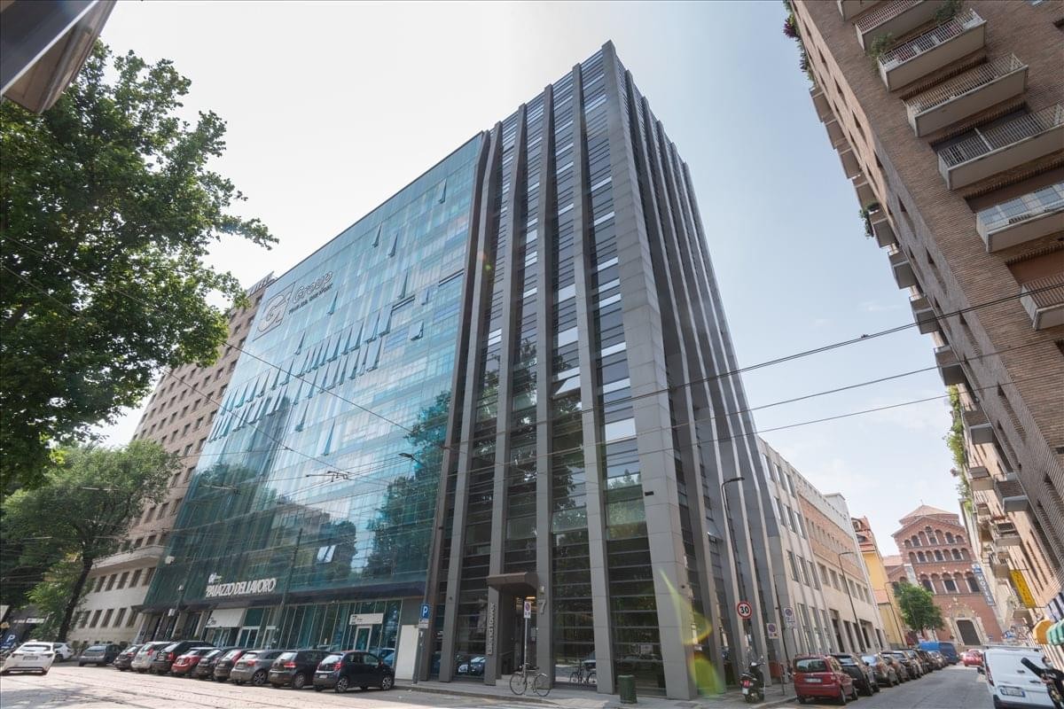Exterior view of the contemporary glass and stone facade at Piazza 4 Novembre, 7.