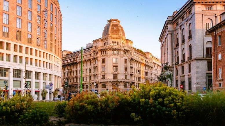 Exterior street view of the historic Piazza Missori building under a clear blue sky.