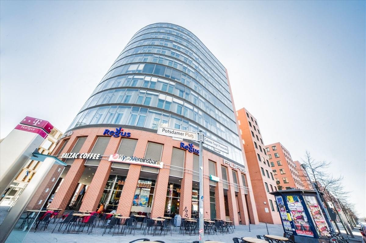 Exterior view of the curved glass-facade building at Potsdamer Platz 10, Haus 2, 5th Floor, Berlin, Germany.
