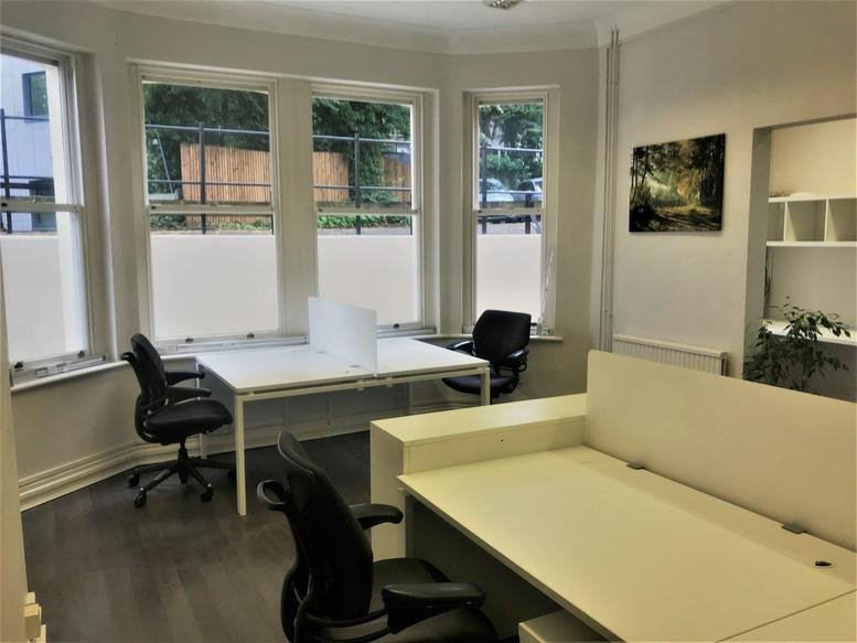 Bright workspace at Prospect House, Lonsdale Gardens with large bay windows and white desks.