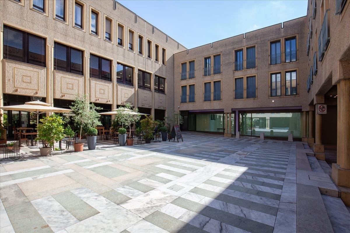 Exterior courtyard and classic stone facade of Quartiere Maghetti.