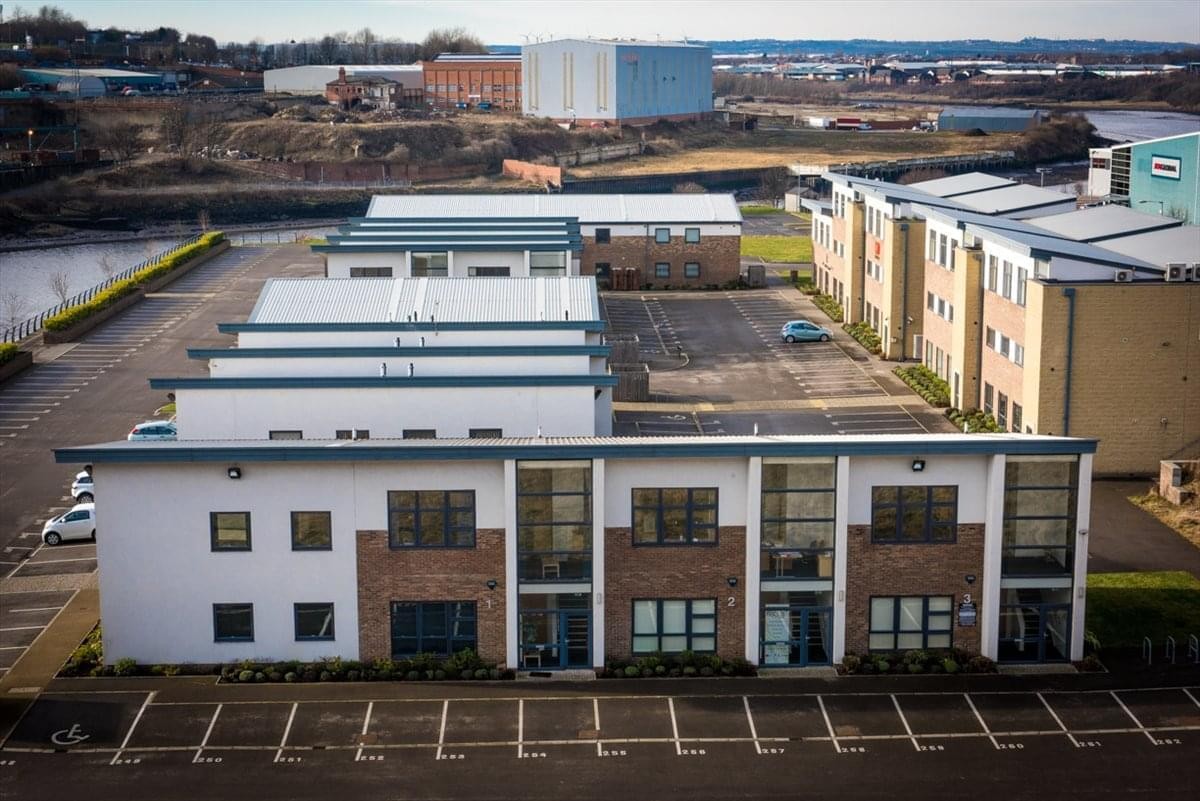 Aerial view of the modern white and brick buildings at Quay West Business Village, Sunderland.